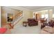 Spacious living room showcasing the staircase and formal dining area at 6873 Lakecrest Ct, Denver, NC 28037