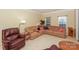 Comfortable living room with neutral carpeting, ample seating, and plenty of natural light at 6873 Lakecrest Ct, Denver, NC 28037