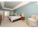 Bright main bedroom boasts an en suite bathroom, accent walls and plush seating at 6873 Lakecrest Ct, Denver, NC 28037