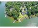 Aerial view of lakeside properties, docks, and lush trees along the Lake Wylie shoreline at 7010 Coventry Ct, Tega Cay, SC 29708
