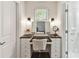 Vanity area featuring a makeup mirror, chair and black countertop at 7010 Coventry Ct, Tega Cay, SC 29708