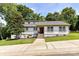Charming home featuring a landscaped front yard, well-maintained lawn, and inviting front entry at 7010 Coventry Ct, Tega Cay, SC 29708