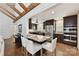Open kitchen with dark cabinets, stainless steel appliances, and an island with seating at 7010 Coventry Ct, Tega Cay, SC 29708