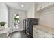 Laundry room with washer and dryer, storage and view to outside deck at 7010 Coventry Ct, Tega Cay, SC 29708