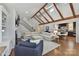 Bright living room with vaulted ceilings, fireplace, and open layout to a modern kitchen at 7010 Coventry Ct, Tega Cay, SC 29708