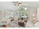 Inviting living room with vaulted ceilings and large windows offering lots of natural light at 7010 Coventry Ct, Tega Cay, SC 29708