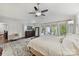 Spacious main bedroom with a ceiling fan, access to a balcony and beautiful outdoor views at 7010 Coventry Ct, Tega Cay, SC 29708