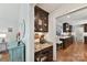 Charming office nook with granite counters and dark wood cabinets located adjacent to the bright kitchen area at 7010 Coventry Ct, Tega Cay, SC 29708