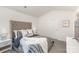 Serene bedroom featuring a large bed, bedside tables and a window at 7109 N Mills Rd, Charlotte, NC 28216