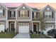 Charming townhouse with a modern exterior and well-maintained landscaping at 7109 N Mills Rd, Charlotte, NC 28216