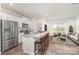 Modern kitchen with stainless steel appliances and a granite countertop island at 7109 N Mills Rd, Charlotte, NC 28216