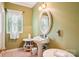 Charming bathroom with pedestal sink, white fixtures and ample counter space at 7612 Maple Bluff Ln, Concord, NC 28025