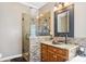 Bathroom with a granite countertop, copper sink and custom tiled glass shower at 7612 Maple Bluff Ln, Concord, NC 28025