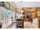 Cozy breakfast nook, bathed in natural light, with a charming round table and seamless flow to the living area at 7612 Maple Bluff Ln, Concord, NC 28025