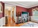 Inviting entryway with a view into a well-lit living room, hardwood floors, and modern decor at 7612 Maple Bluff Ln, Concord, NC 28025