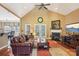 Comfortable living room featuring a fireplace, vaulted ceilings, and hardwood floors at 7612 Maple Bluff Ln, Concord, NC 28025