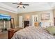 Spacious main bedroom showcasing a comfortable layout and direct access to the en-suite bathroom at 7612 Maple Bluff Ln, Concord, NC 28025