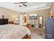 Well-lit main bedroom featuring a spacious layout and convenient access to the en-suite bathroom and kitchen at 7612 Maple Bluff Ln, Concord, NC 28025
