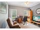 This home office has 2 large windows, a ceiling fan, and neutral paint at 7612 Maple Bluff Ln, Concord, NC 28025
