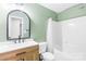 Bathroom featuring updated fixtures, vanity and tub/shower combo at 8614 Westhope St, Charlotte, NC 28216