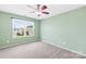 The bedroom has lots of light and neutral carpeting at 8614 Westhope St, Charlotte, NC 28216