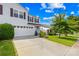 Inviting two-story home with a well-maintained lawn, an attached garage, and a long driveway at 8614 Westhope St, Charlotte, NC 28216