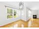 Cozy living room with large windows, fireplace, and access to the backyard at 8614 Westhope St, Charlotte, NC 28216