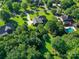 Aerial view of a home with lush greenery and a well-maintained lawn in a residential area at 908 Haddonfield Dr, Fort Mill, SC 29708