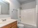Bathroom with a tub and shower combo, a mirror over the sink, and a wooden vanity at 908 Haddonfield Dr, Fort Mill, SC 29708