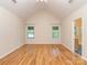 Spacious main bedroom with large windows and hardwood floors at 908 Haddonfield Dr, Fort Mill, SC 29708