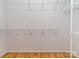 Walk-in closet with custom shelving and hardwood floors at 908 Haddonfield Dr, Fort Mill, SC 29708