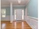 Bright foyer with hardwood floors, wainscoting, and natural light streaming in from nearby windows at 908 Haddonfield Dr, Fort Mill, SC 29708