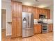 Charming kitchen with stainless steel appliances, custom cabinets, granite countertops, and hardwood floors at 908 Haddonfield Dr, Fort Mill, SC 29708