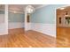 Spacious living room with hardwood floors, recessed lighting, and an open doorway to adjacent spaces at 908 Haddonfield Dr, Fort Mill, SC 29708