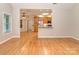 Spacious living room with hardwood floors seamlessly flowing into an open-concept kitchen and dining area at 908 Haddonfield Dr, Fort Mill, SC 29708