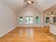 Open living room with vaulted ceilings, hardwood floors, and multiple windows offering natural light at 908 Haddonfield Dr, Fort Mill, SC 29708