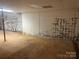 Unfinished basement with painted cinder block walls and concrete floors, providing a blank canvas at 9314 Seymour Ln, Davidson, NC 28036