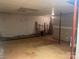 Spacious unfinished basement with concrete floor and block walls; ideal for storage or customization at 9314 Seymour Ln, Davidson, NC 28036