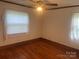 This bedroom features hardwood floors, neutral walls and a ceiling fan at 9314 Seymour Ln, Davidson, NC 28036