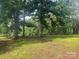 A gorgeous expansive lot with lush grass and mature trees for an ideal serene homesite at 9314 Seymour Ln, Davidson, NC 28036