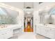 Luxury bath with dual vanities, mirrors, and walk-in shower at 9514 Hayenridge Ct, Huntersville, NC 28078