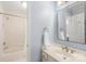 Bathroom showcasing a single sink vanity and a bathtub with a shower, offering a functional design at 9514 Hayenridge Ct, Huntersville, NC 28078