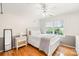 Bright bedroom with hardwood floors, half wall trim, and natural light from a window at 9514 Hayenridge Ct, Huntersville, NC 28078