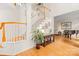 Spacious foyer with hardwood floors, white staircase, and elegant decor, showcasing a grand entrance at 9514 Hayenridge Ct, Huntersville, NC 28078
