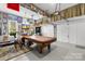 Spacious garage set up with a pool table, decorative lighting, and ample space for parking at 9514 Hayenridge Ct, Huntersville, NC 28078