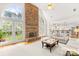 Spacious living room with stone fireplace, hardwood floors and view into the kitchen at 9514 Hayenridge Ct, Huntersville, NC 28078