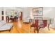 Open-concept living area with a piano, hardwood floors, and seamless flow to the dining room at 9514 Hayenridge Ct, Huntersville, NC 28078