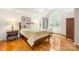 Spacious main bedroom with a large window, wood floors, and a ceiling fan at 9514 Hayenridge Ct, Huntersville, NC 28078