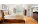Bright main bedroom with wood floors and an arched window at 9514 Hayenridge Ct, Huntersville, NC 28078