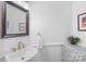 Stylish powder room with modern sink, mirror and decor at 9514 Hayenridge Ct, Huntersville, NC 28078